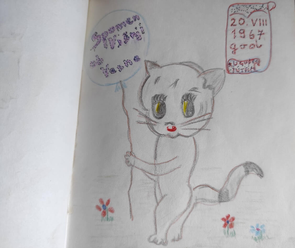 Nacrtana mačka koja stoji uz posvetu i datum